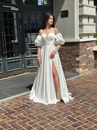 Elegant Silhouette Wedding Dress with Open Shoulders | Deep V-Neckline & Button Detail | Romantic Bridal Gown