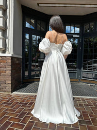 Elegant Silhouette Wedding Dress with Open Shoulders | Deep V-Neckline & Button Detail | Romantic Bridal Gown