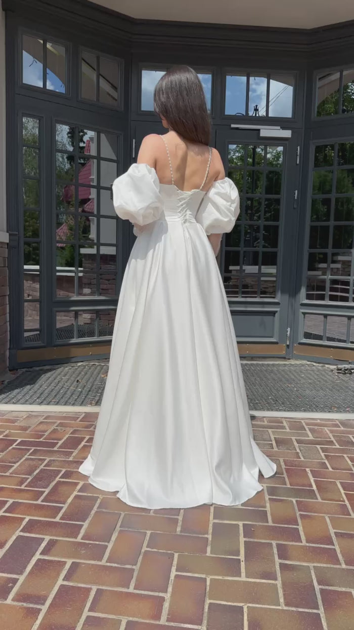 Elegant Silhouette Wedding Dress with Open Shoulders | Deep V-Neckline & Button Detail | Romantic Bridal Gown